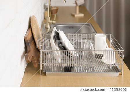Kitchen with various kitchen tools, kitchen lathe and plants background. Dry dish and bowl shaped. Kitchen with various kitchen tools, kitchen lathe and plants background. Dry dish and bowl shaped. 43358002