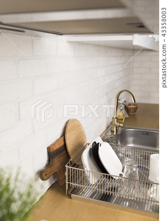 Kitchen with various kitchen tools, kitchen lathe and plants background. Dry dish and bowl shaped. Kitchen with various kitchen tools, kitchen lathe and plants background. Dry dish and bowl shaped. 43358003