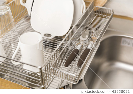 Kitchen with various kitchen tools, kitchen lathe and plants background. Dry dish and bowl shaped. Kitchen with various kitchen tools, kitchen lathe and plants background. Dry dish and bowl shaped. 43358031
