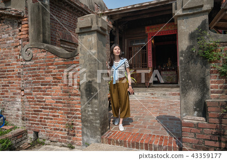 standing in the old tranditional house. standing in the old tranditional house. 43359177