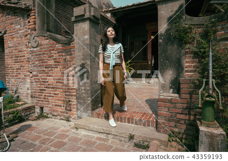 asian tourist visiting the old traditional house. 43359193