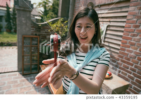 asian visitor trying the ancient craft. 43359195