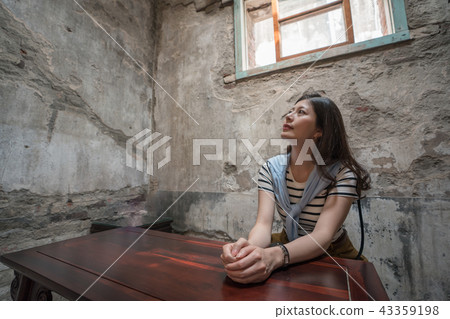 asian female siiting in the old house. 43359198