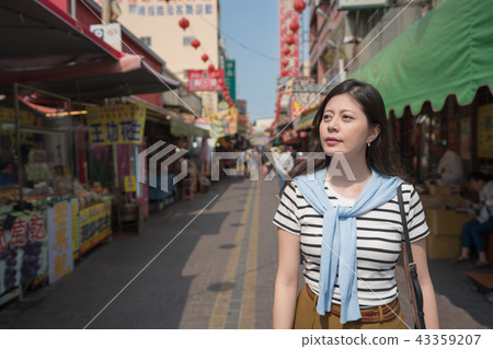 asian woman visiting the traditional market in taiwan. 43359207