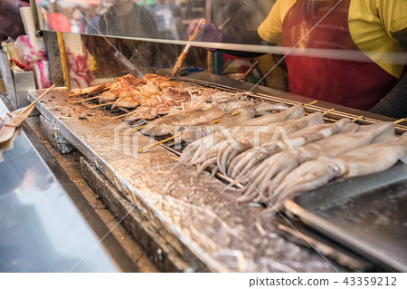 visiting street food in traditional markets. visiting street food in traditional markets. 43359212