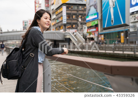 beautiful asian woman standing at the river 43359326