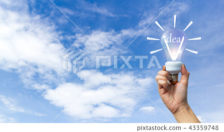 Idea concept hand holding lamp sky background. Idea concept hand holding lamp sky background. 43359748