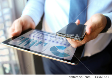 Business man working, analyzing financial figures 43361847