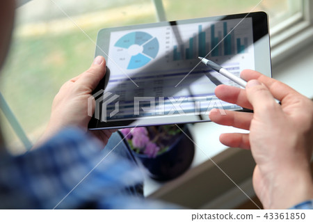 man working and analyzing financial figures man working and analyzing financial figures 43361850