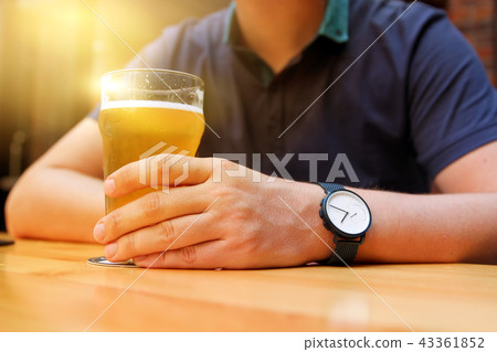 Young man drinking beer in the bar 43361852