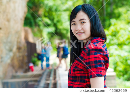 Beautiful asian women smiling at park outdoor Beautiful asian women smiling at park outdoor 43362669