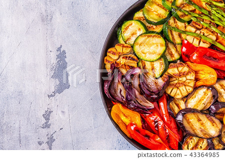 Grilled vegetables on a plate with sauce. Grilled vegetables on a plate with sauce. 43364985