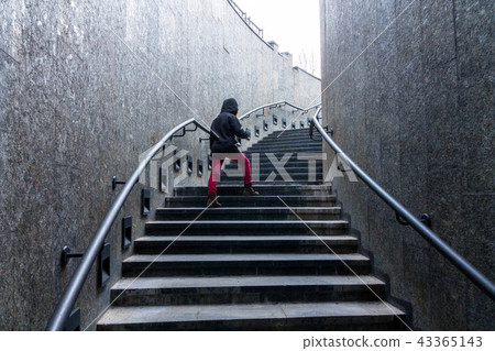 Man climbs the stairs. Stairs up. 43365143