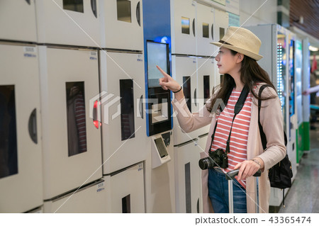 woman confirming intelligent coin lockers. 43365474