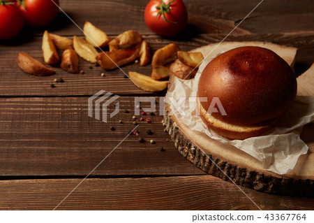 Burger with fried potatoes. 43367764