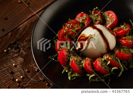 Mozzarella with tomatoes. 43367765