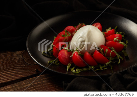 Mozzarella with tomatoes. 43367769