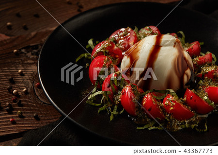 Mozzarella with tomatoes. 43367773