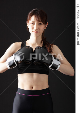 Female fighter doing boxer size 43367917