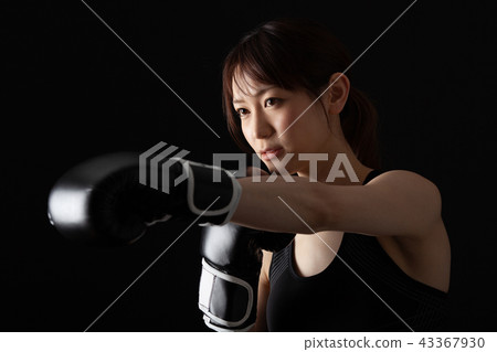 Female fighter doing boxer size 43367930