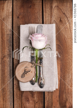 autumn table setting, decor of leaves and pumpkin. A festive dinner in a vintage style. Village autumn table setting, decor of leaves and pumpkin. A festive dinner in a vintage style. Village 43368786