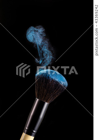Make up brush with powder splashes on black background Make up brush with powder splashes on black background 43369242