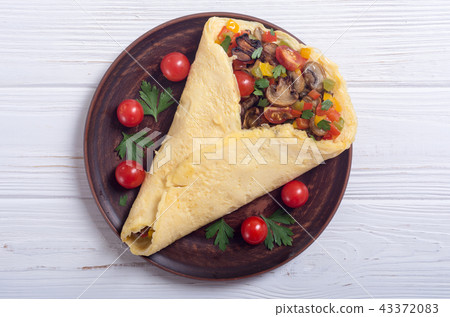 Omelette stuffed with vegetables 43372083