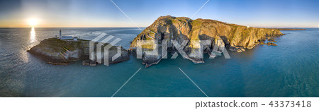 Aerial view of the beautiful cliffs close to the historic South Stack lighthouse on Anglesey - Wales 43373418