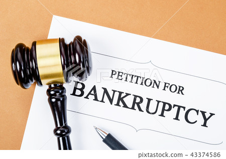 Bankruptcy document with wooden gavel. Bankruptcy document with wooden gavel. 43374586