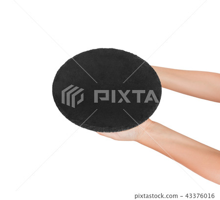 empty black slate round stone in the hand empty black slate round stone in the hand 43376016