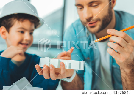 Cheerful males discussing their project 43376843