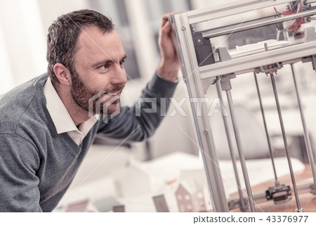 Bearded designer waiting when his prototype being ready Bearded designer waiting when his prototype being ready 43376977