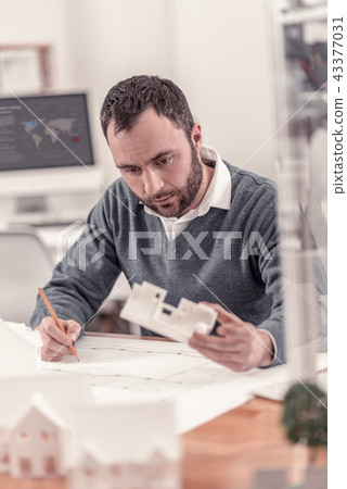 Smart architect creating drawings of the house Smart architect creating drawings of the house 43377031