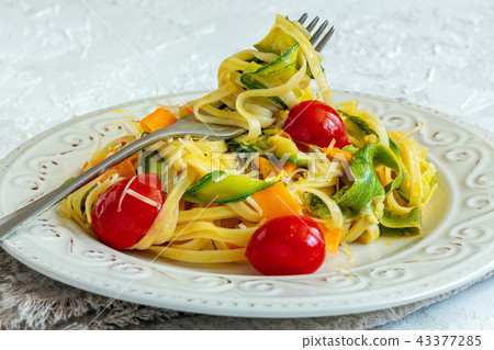 Pasta with vegetables, parmesan and lemon zest. Pasta with vegetables, parmesan and lemon zest. 43377285