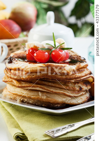 Pancakes with chocolate sauce fruit and coffee Pancakes with chocolate sauce fruit and coffee 43377579