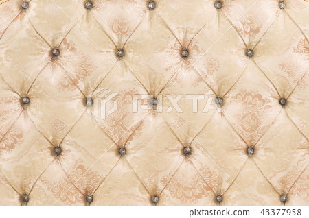 Beige soft tapestry pattern background with symmetrical buttons on the corners of diamonds. Soft and 43377958