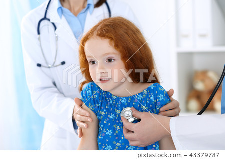 Doctor examining a little girl with stethoscope.Medicine and healthcare concept 43379787