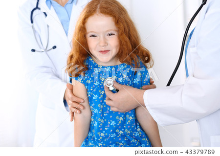 Doctor examining a little girl with stethoscope.Medicine and healthcare concept 43379789