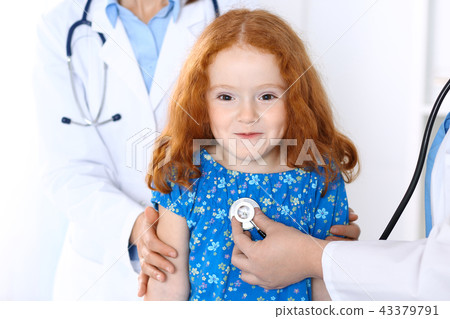Doctor examining a little girl with stethoscope.Medicine and healthcare concept 43379791