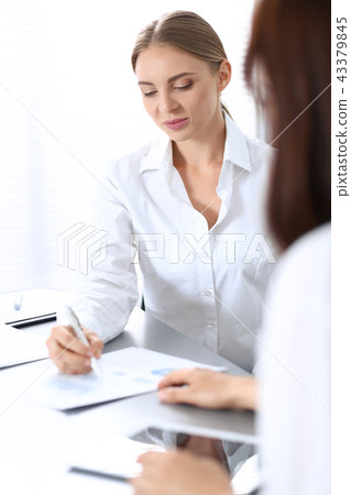 Group of business people or lawyers discussing terms of transaction in office. Meeting and teamwor Group of business people or lawyers discussing terms of transaction in office. Meeting and teamwor 43379845