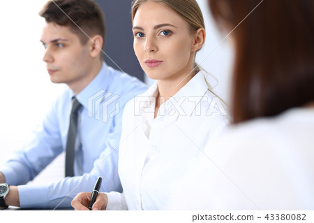Group of business people or lawyers discussing terms of transaction in office. Meeting and teamwor Group of business people or lawyers discussing terms of transaction in office. Meeting and teamwor 43380082