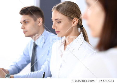 Group of business people or lawyers discussing terms of transaction in office. Meeting and teamwor Group of business people or lawyers discussing terms of transaction in office. Meeting and teamwor 43380083