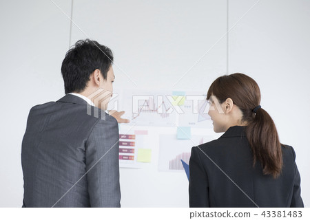 Business person man and woman back view 43381483