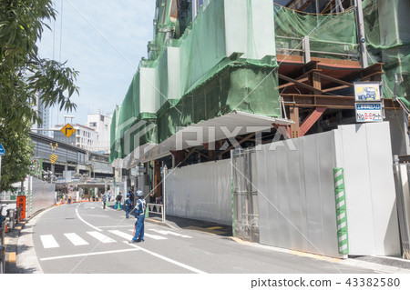Shibuya Station block road use permission security guard placement import road security securing during redevelopment construction 43382580