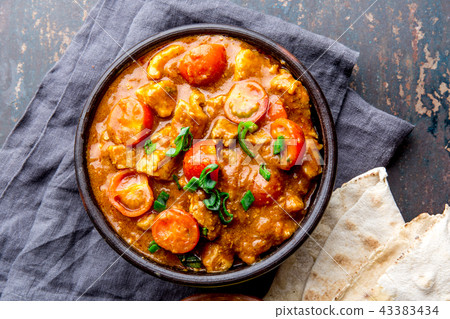 INDIAN FOOD. ROGAN JOSH curry sauce. Pork rogan josh with rice and naan bread 43383434