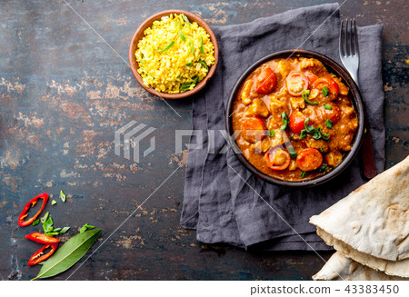 INDIAN FOOD. ROGAN JOSH curry sauce. Pork rogan josh with rice and naan bread INDIAN FOOD. ROGAN JOSH curry sauce. Pork rogan josh with rice and naan bread 43383450