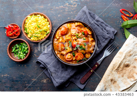 INDIAN FOOD. ROGAN JOSH curry sauce. Pork rogan josh with rice and naan bread INDIAN FOOD. ROGAN JOSH curry sauce. Pork rogan josh with rice and naan bread 43383463