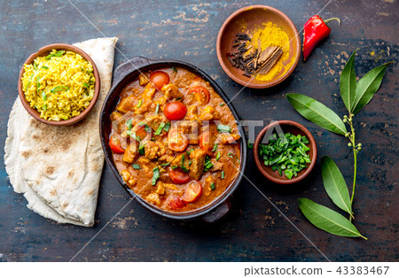 INDIAN FOOD. ROGAN JOSH curry sauce. Pork rogan josh with rice and naan bread INDIAN FOOD. ROGAN JOSH curry sauce. Pork rogan josh with rice and naan bread 43383467