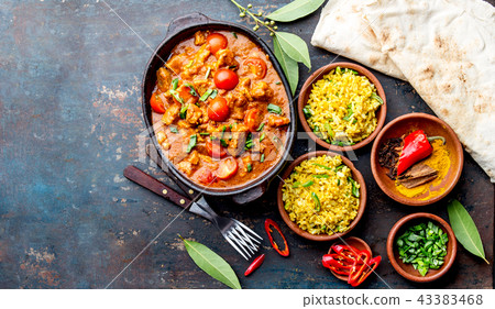 INDIAN FOOD. ROGAN JOSH curry sauce. Pork rogan josh with rice and naan bread INDIAN FOOD. ROGAN JOSH curry sauce. Pork rogan josh with rice and naan bread 43383468