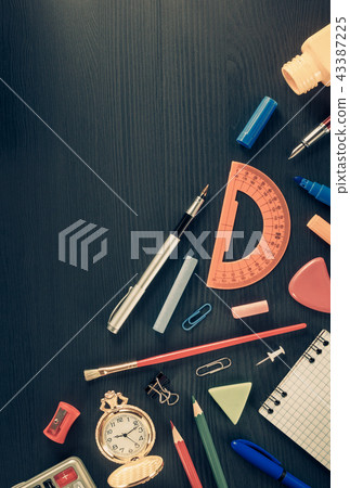 school supplies on black wood school supplies on black wood 43387225